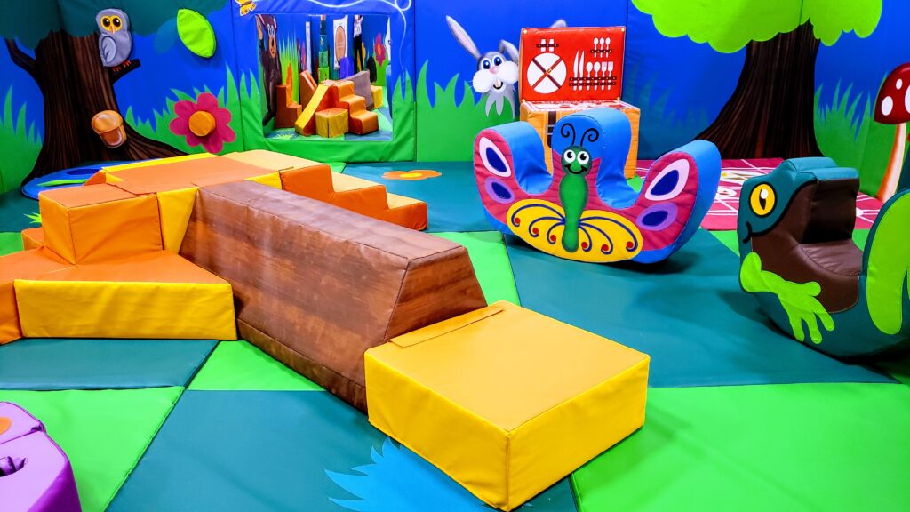 Toddler play area with soft structures at Indigo Play.