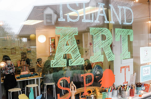 Front window view into Island Art Spot's studio in Middletown