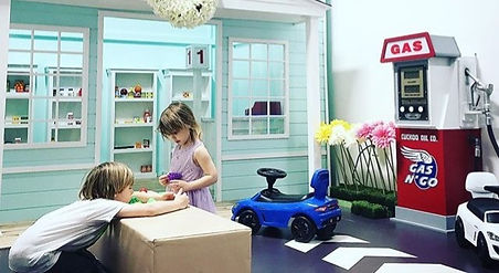 Children playing in the pretend-play town at It's Playtime.