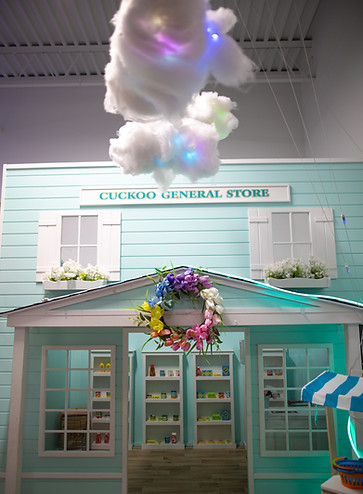 Playhouse storefront inside It's Playtime's town-themed play area.