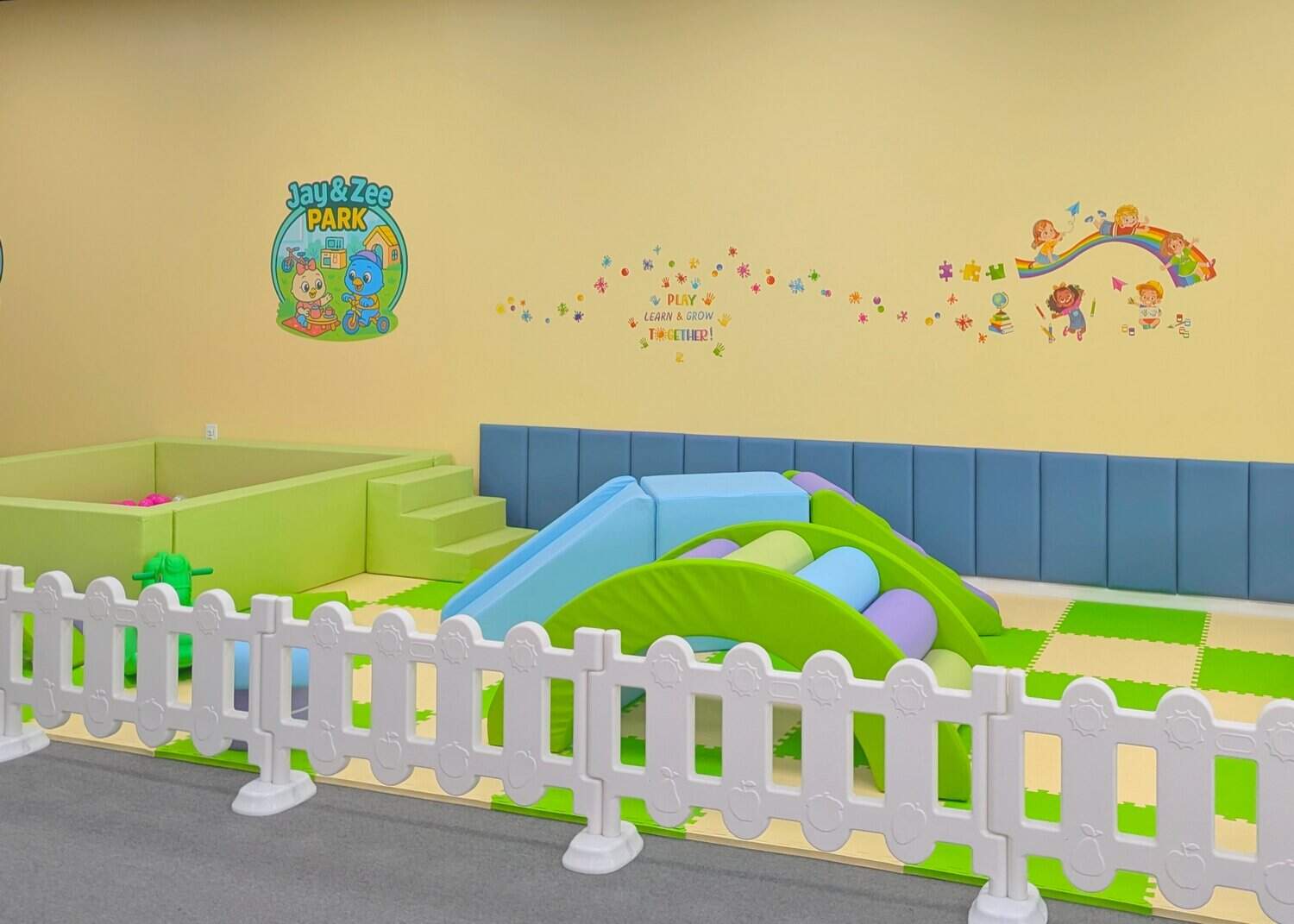 Soft toddler play area with low climbing features at Jay & Zee Play Cafe.