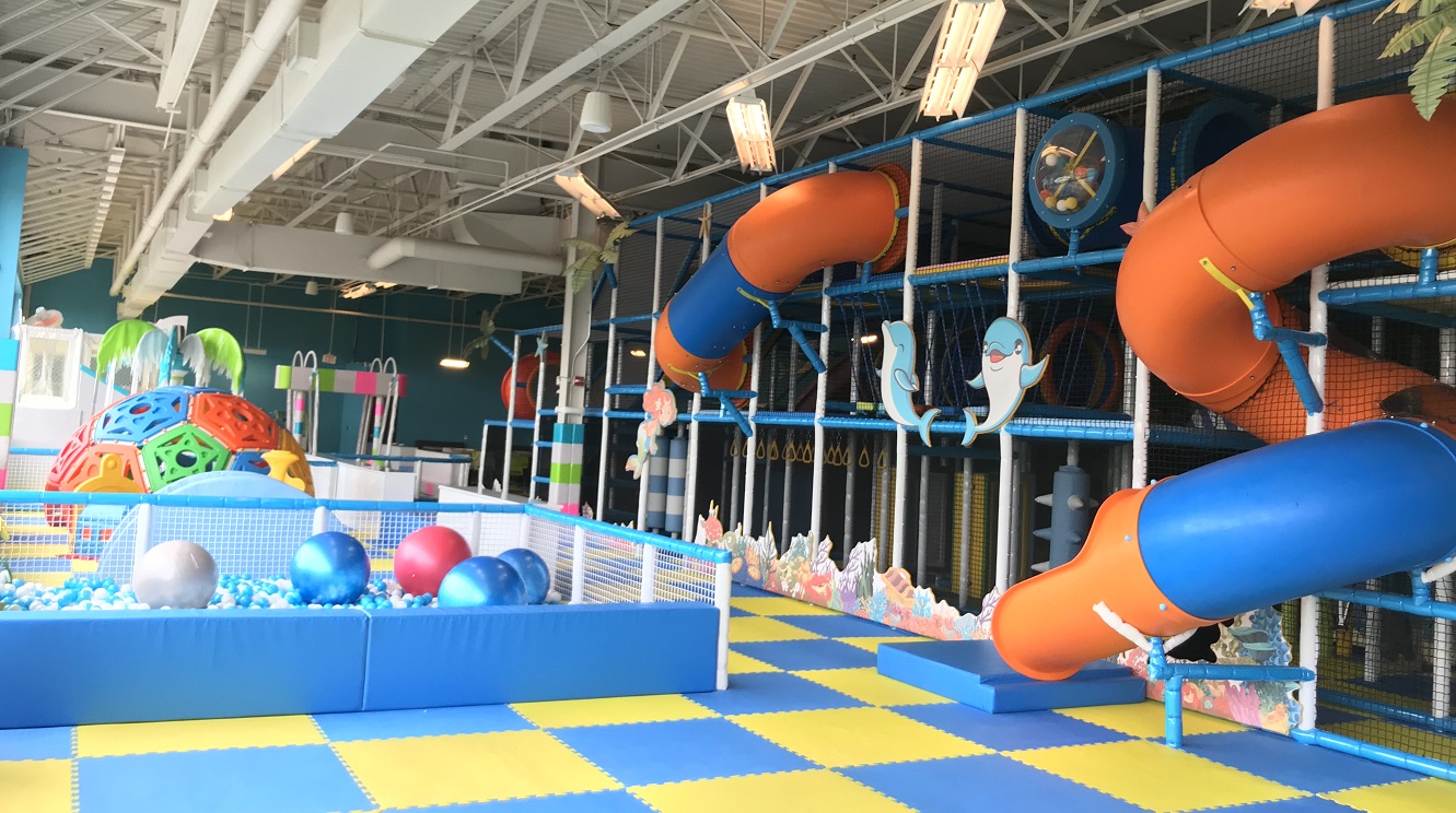 Multilevel indoor play structure at Jolly Yolly Kids.