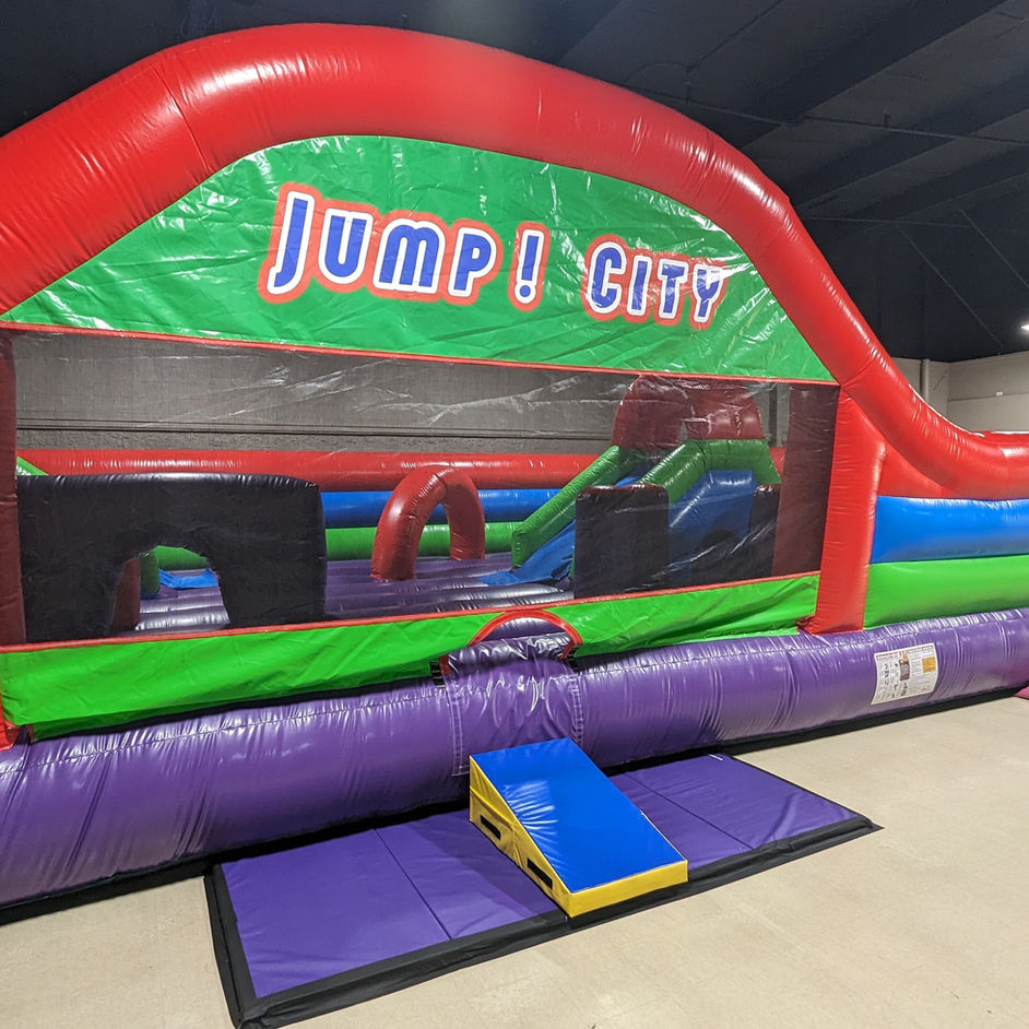 Children playing on inflatable equipment at Jump! City Albany.
