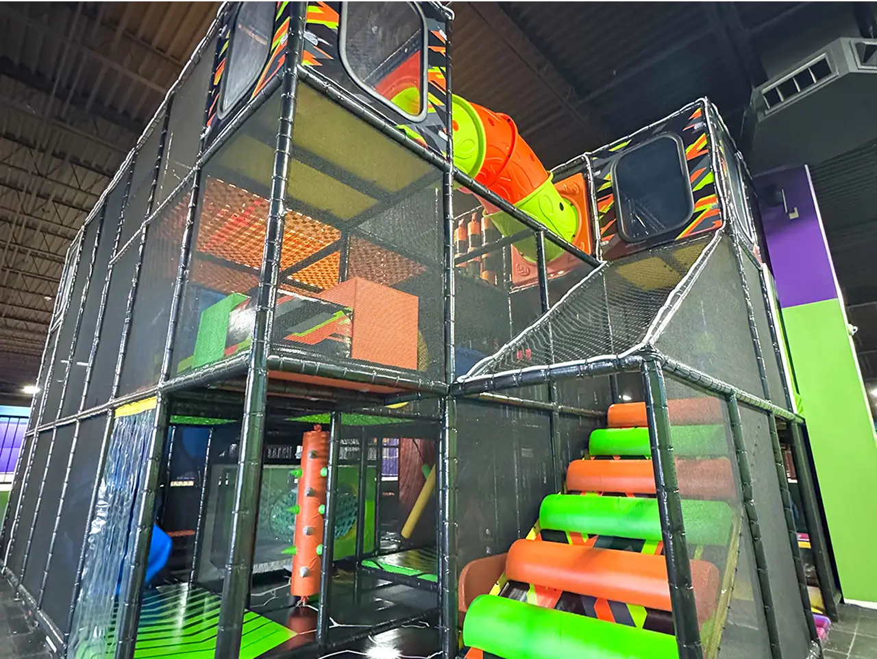 Indoor playground structure at Jump City Trampoline Park.