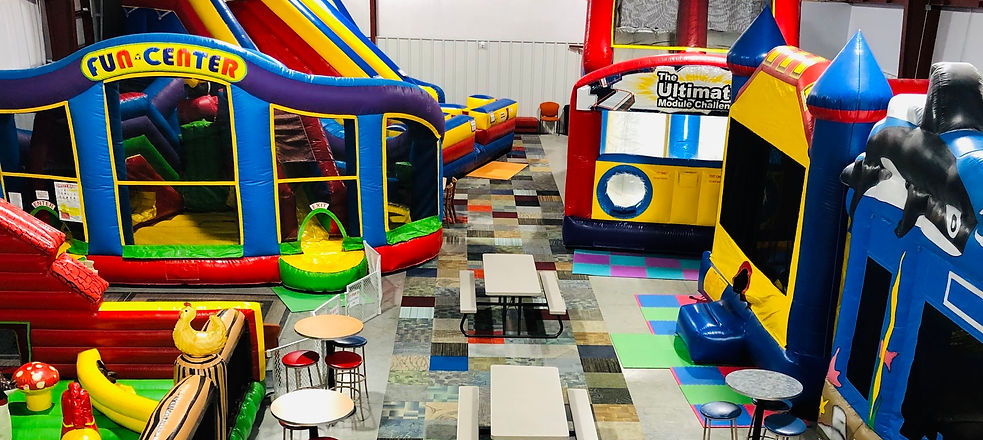 Close-up look at multiple inflatables inside Jump Mania.
