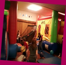 Wide view of the Jump N Jax indoor play area with inflatable-style attractions.