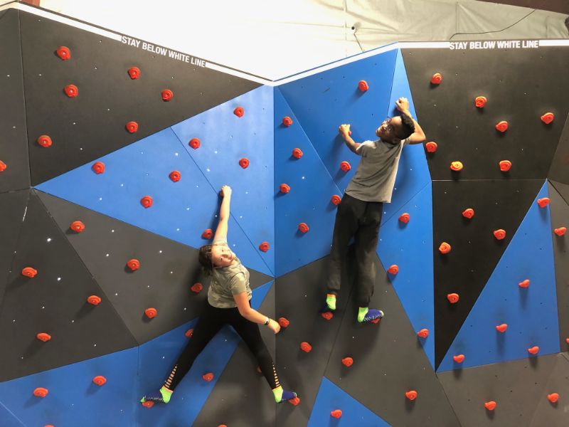 Kids on the climbing wall at Jump Time Bozeman