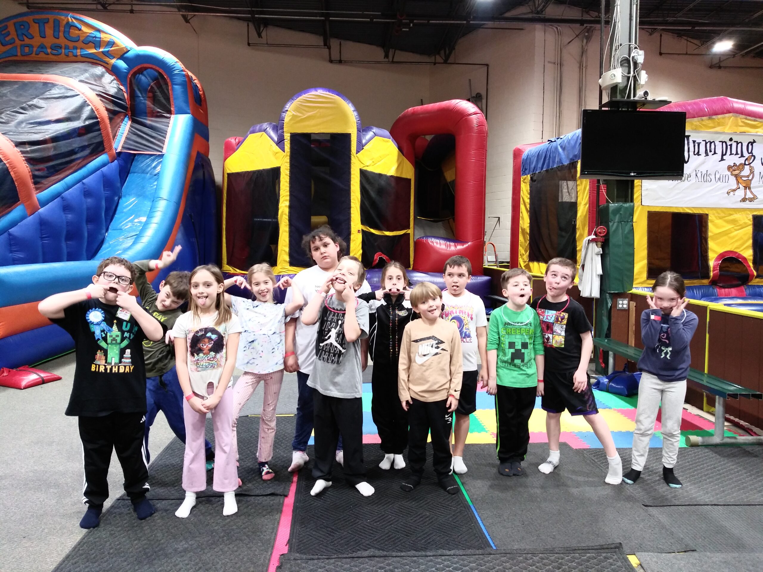 Kids near the inflatable play area at Jumping Jungle.