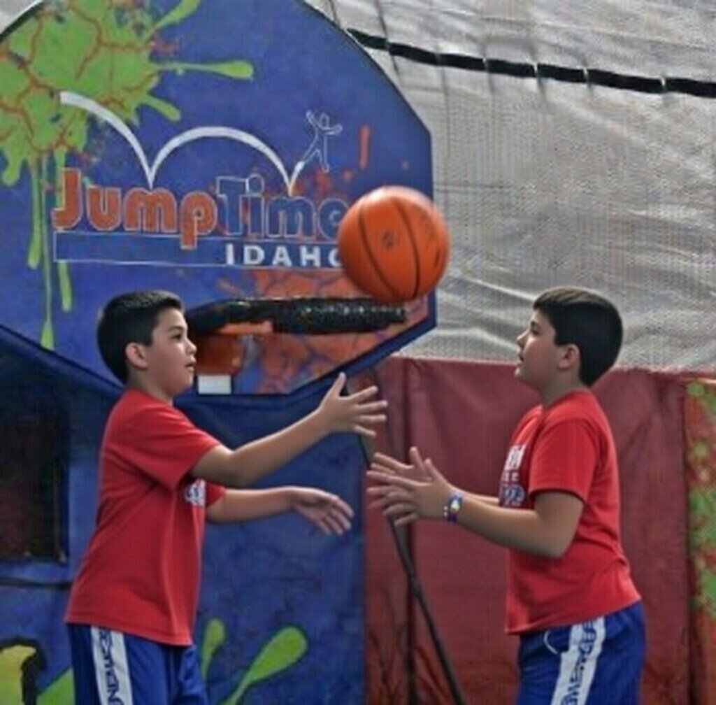 Children playing basketball at JumpTime