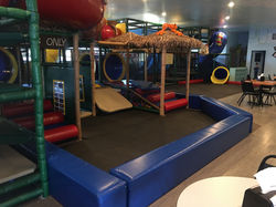 Soft play seating and toddler area inside Jungle Gym's.