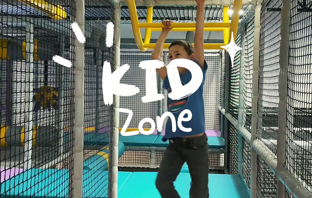 Indoor play structure and open play floor at Kid Zone Idaho Falls.