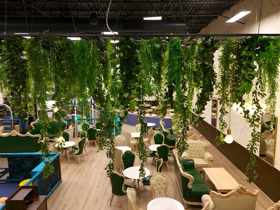 Café seating area overlooking the play floor at Kidcadia Play Café.