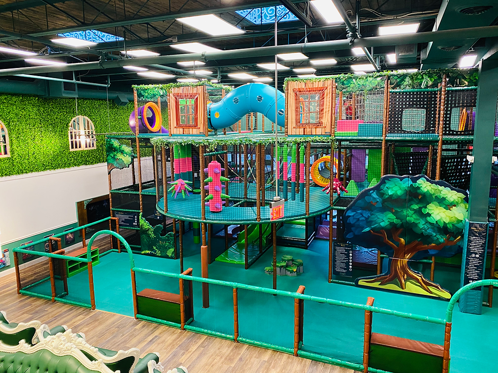 Play area seating and indoor playground space at Kidcadia Play Cafe.