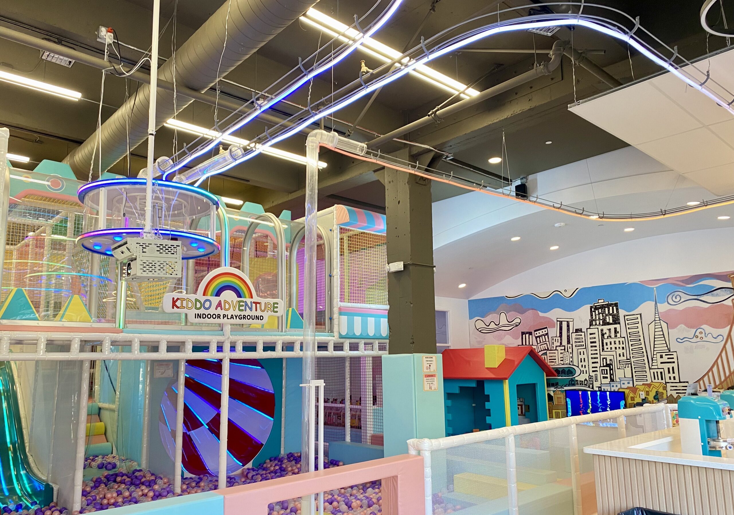 Main play structure with ball pit and playhouse at Kiddo Adventure in San Mateo.