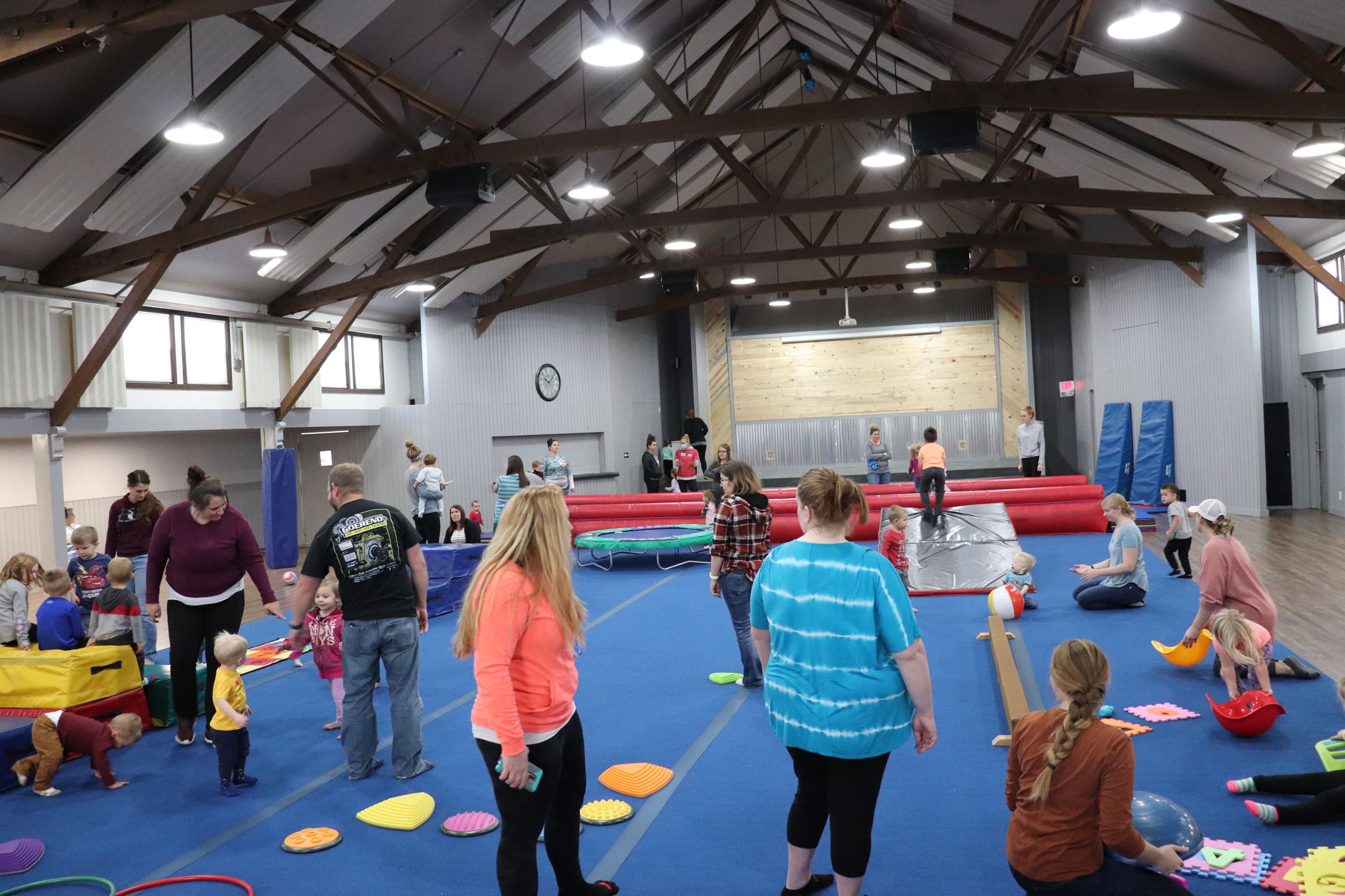 Families gathered for soft indoor play at Kids in Motion