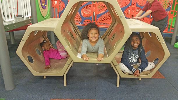 Children playing inside the Kids' Korner Indoor Playground at McMillen Park Community Center.