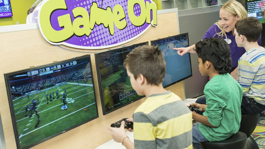 Kids playing video games inside Kids Quest Northern Quest.