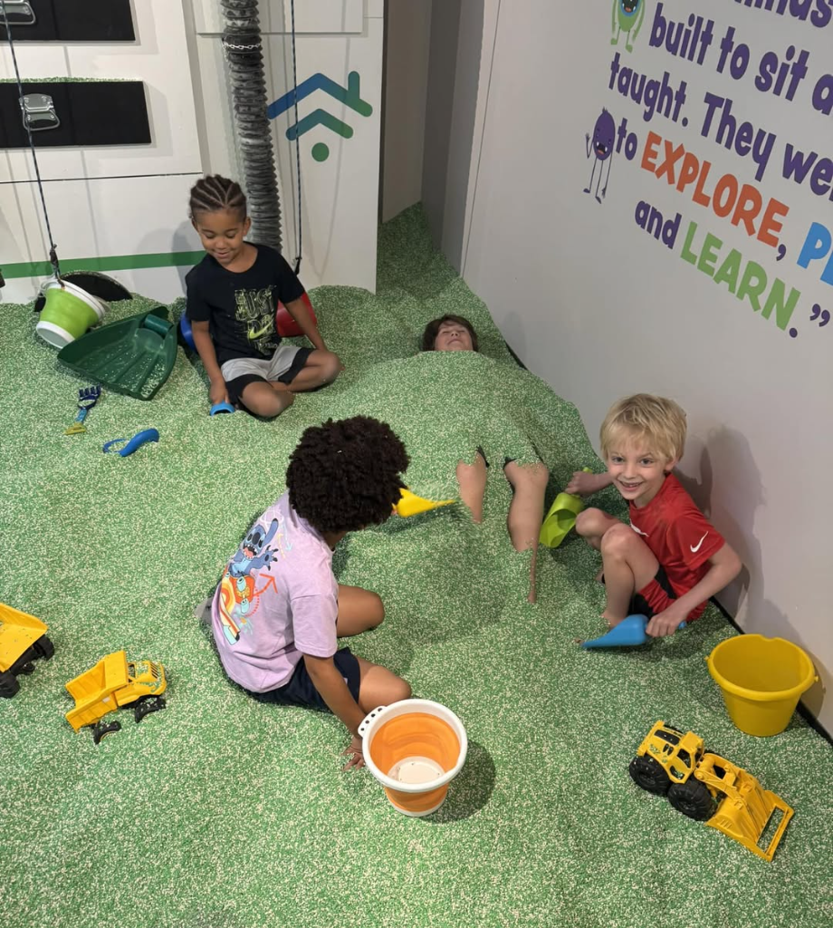 Kids exploring a hands-on play exhibit at Kids Square in Roanoke.