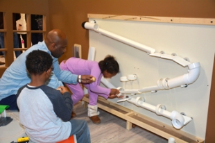 Children building and experimenting in KidSpace