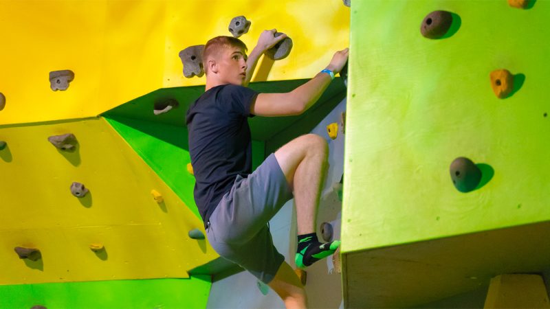 Indoor climbing wall attraction at Launch Brooklyn.