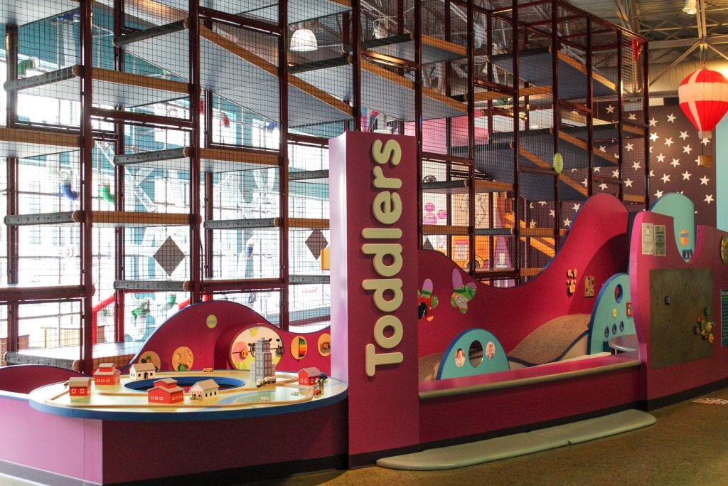 Toddler area inside LaunchPAD Children's Museum next to the large indoor climber.