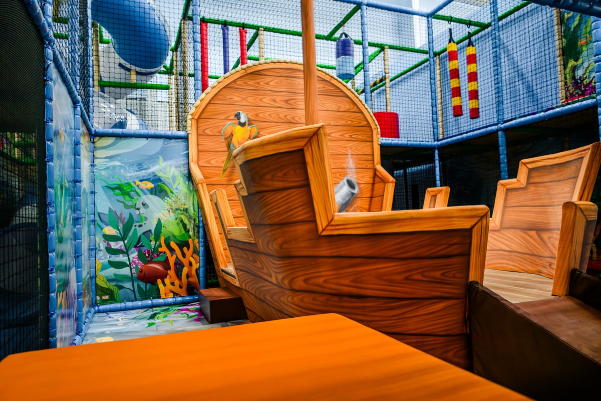 Pirate ship themed play feature inside Lava Island Billings.