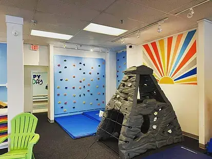 Rock wall and volcano-themed climbing area at Let's Play in Kittery.