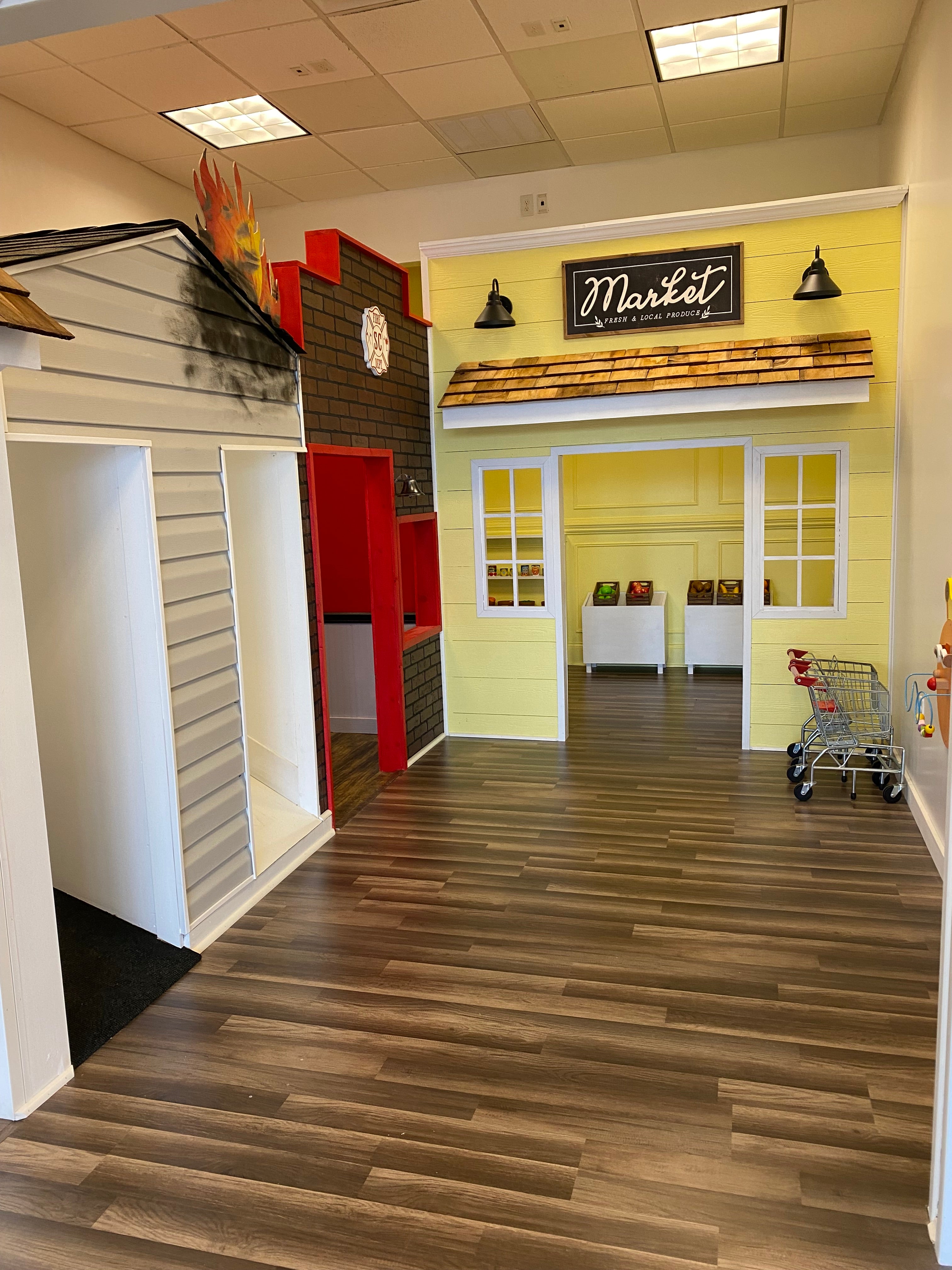 Pretend-play storefronts inside Let's Play Pretend