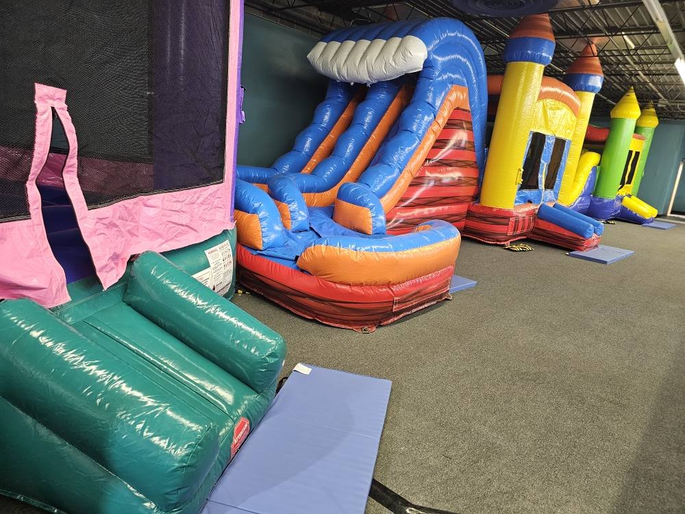 Inflatable bounce houses and slides at Level Up Bounce in Elmira.