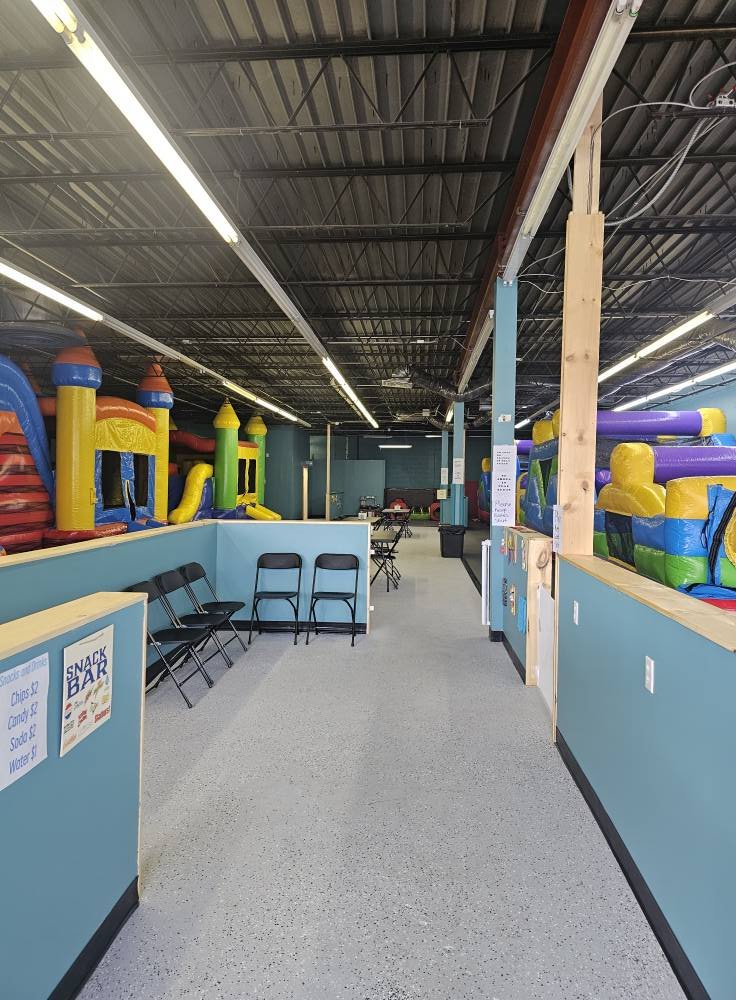 Walkway and seating area inside Level Up Bounce.