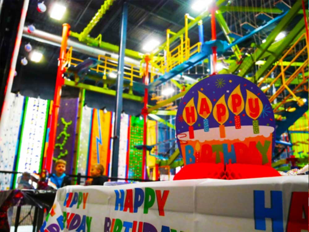 Party area with ropes course in the background at LiggettVille