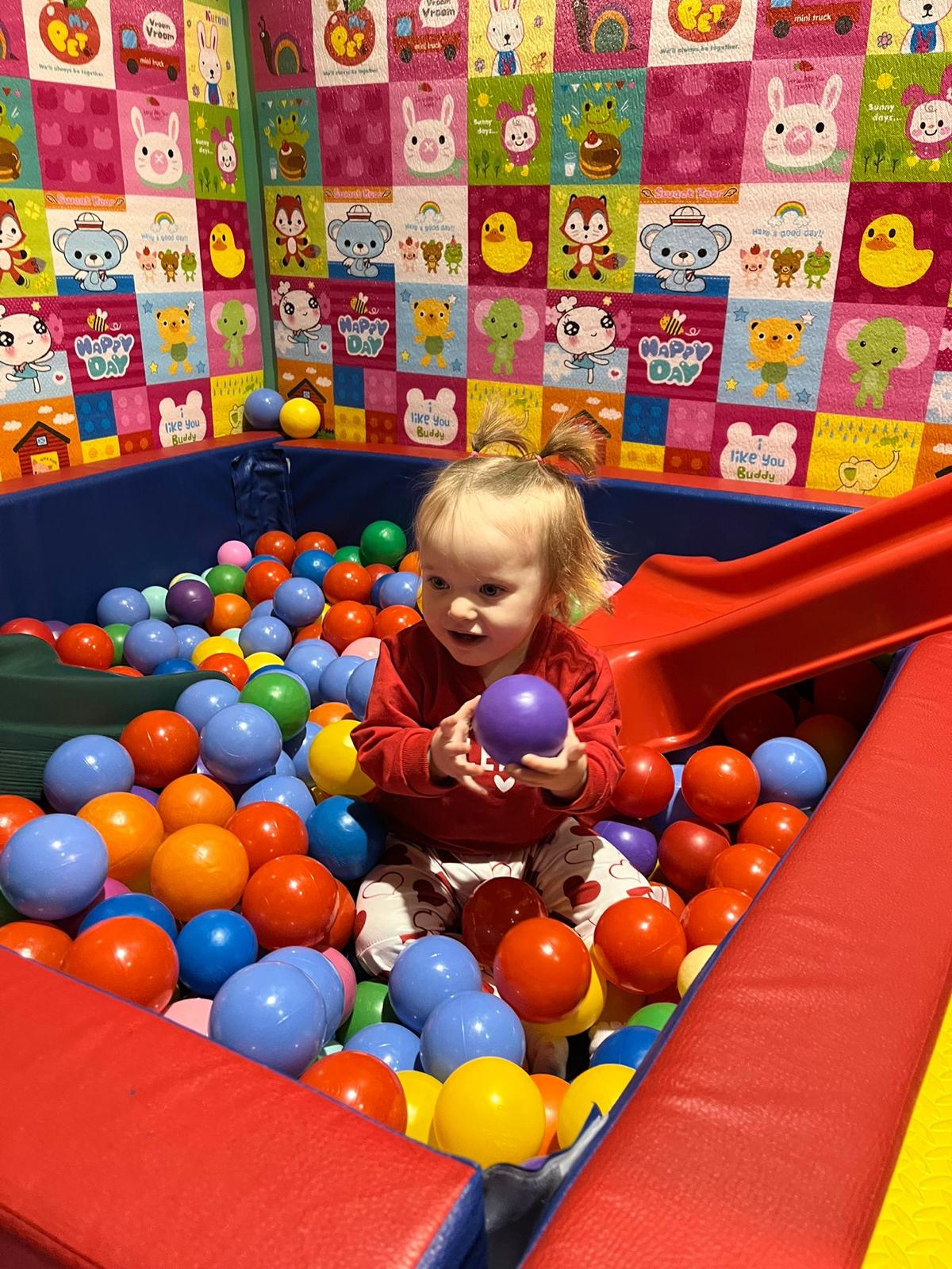 Toddler ball pit with small slide at Lil Bunny Play