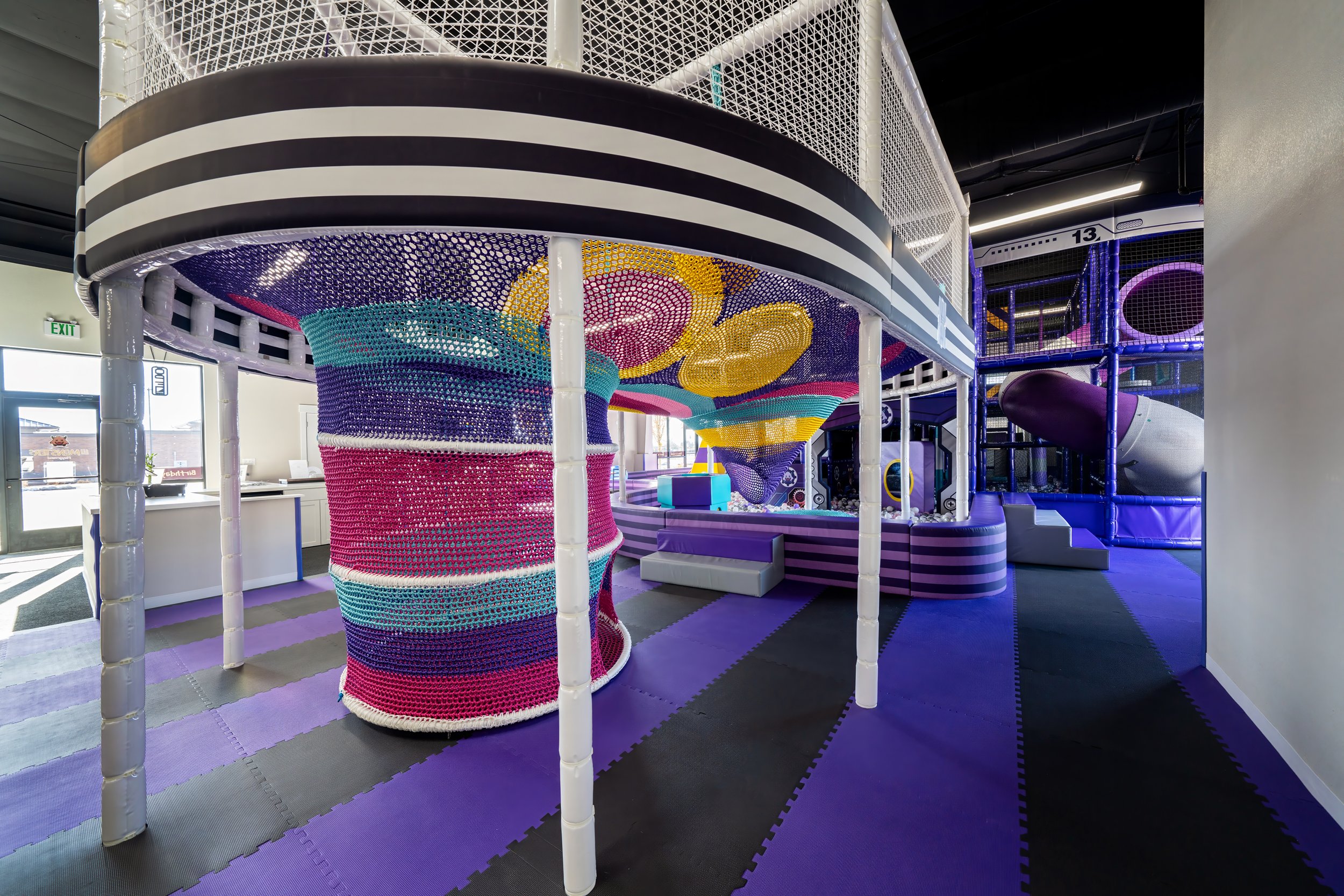 Play features and seating inside Lil Monsters Playground.