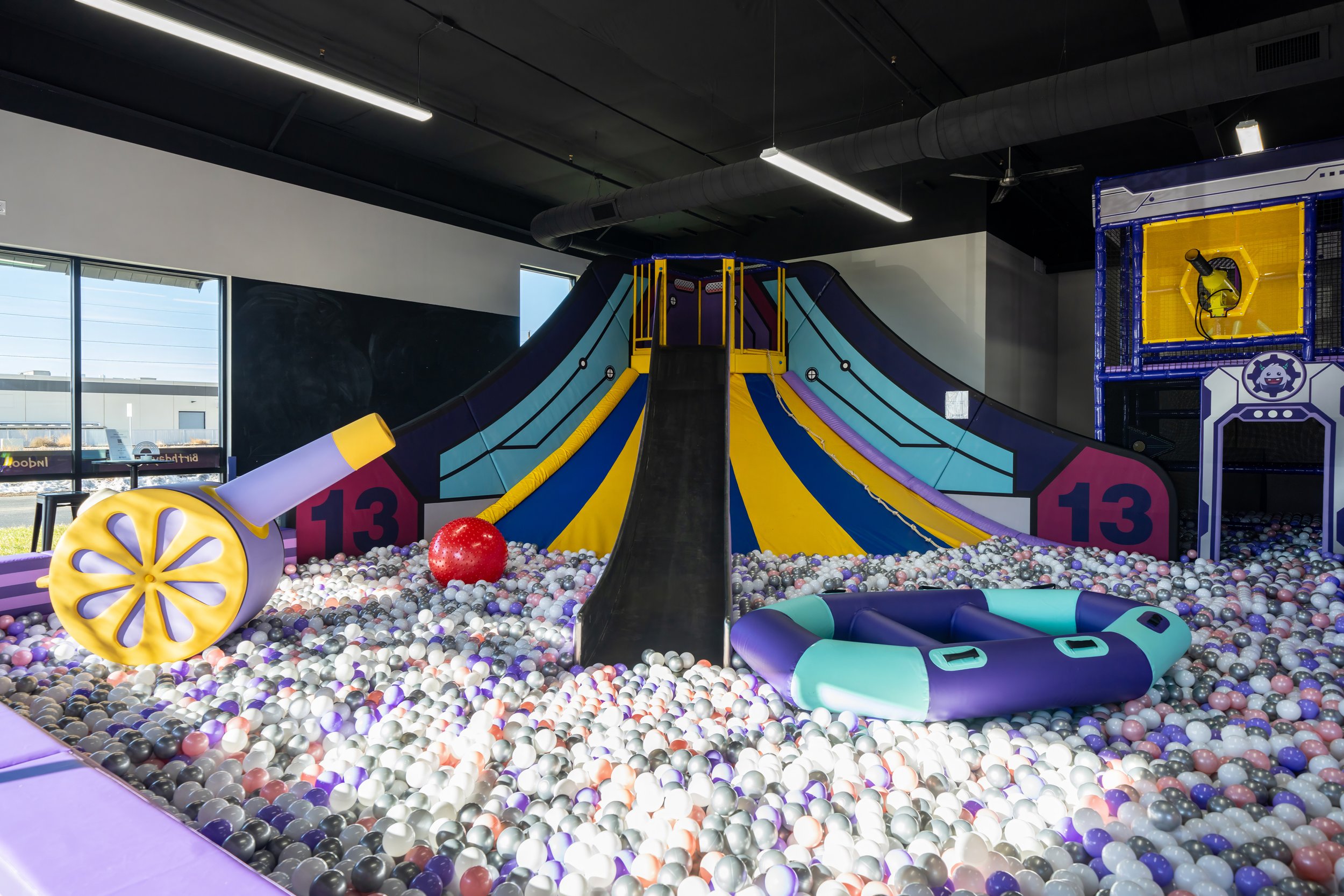 Children exploring padded play equipment at Lil Monsters Playground.