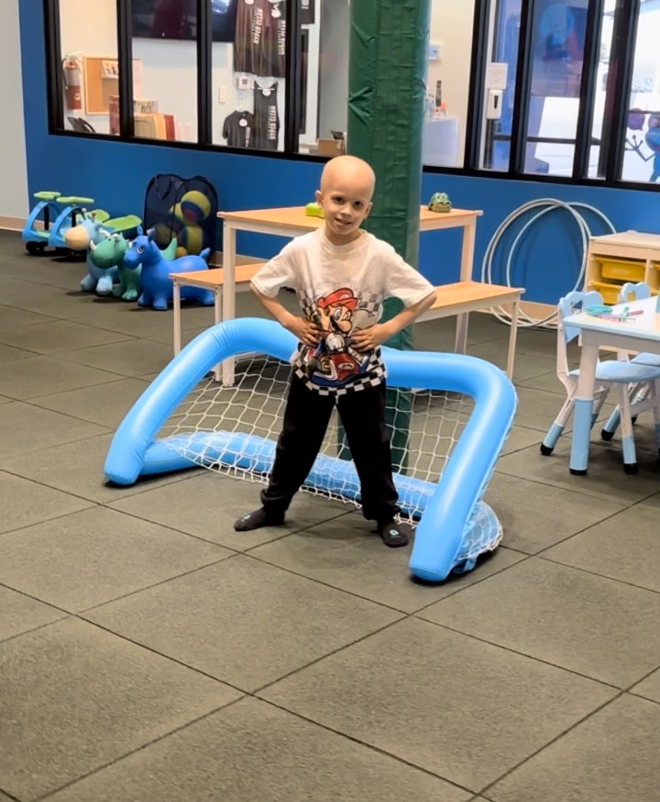 Child using play activity at Lily's Pad