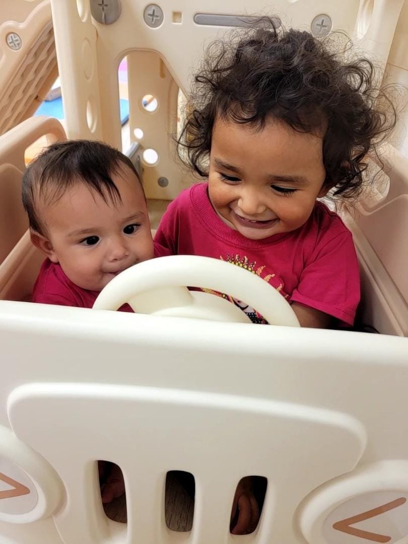 Young children playing inside Little Beans Play Café.