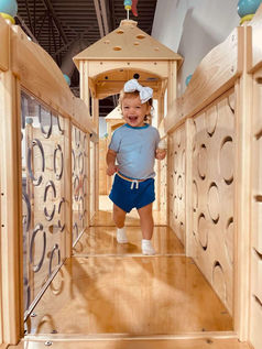 Child inside the play structure at Little Fox Clubhouse