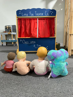 Pretend play puppet theater at Little Fox Clubhouse