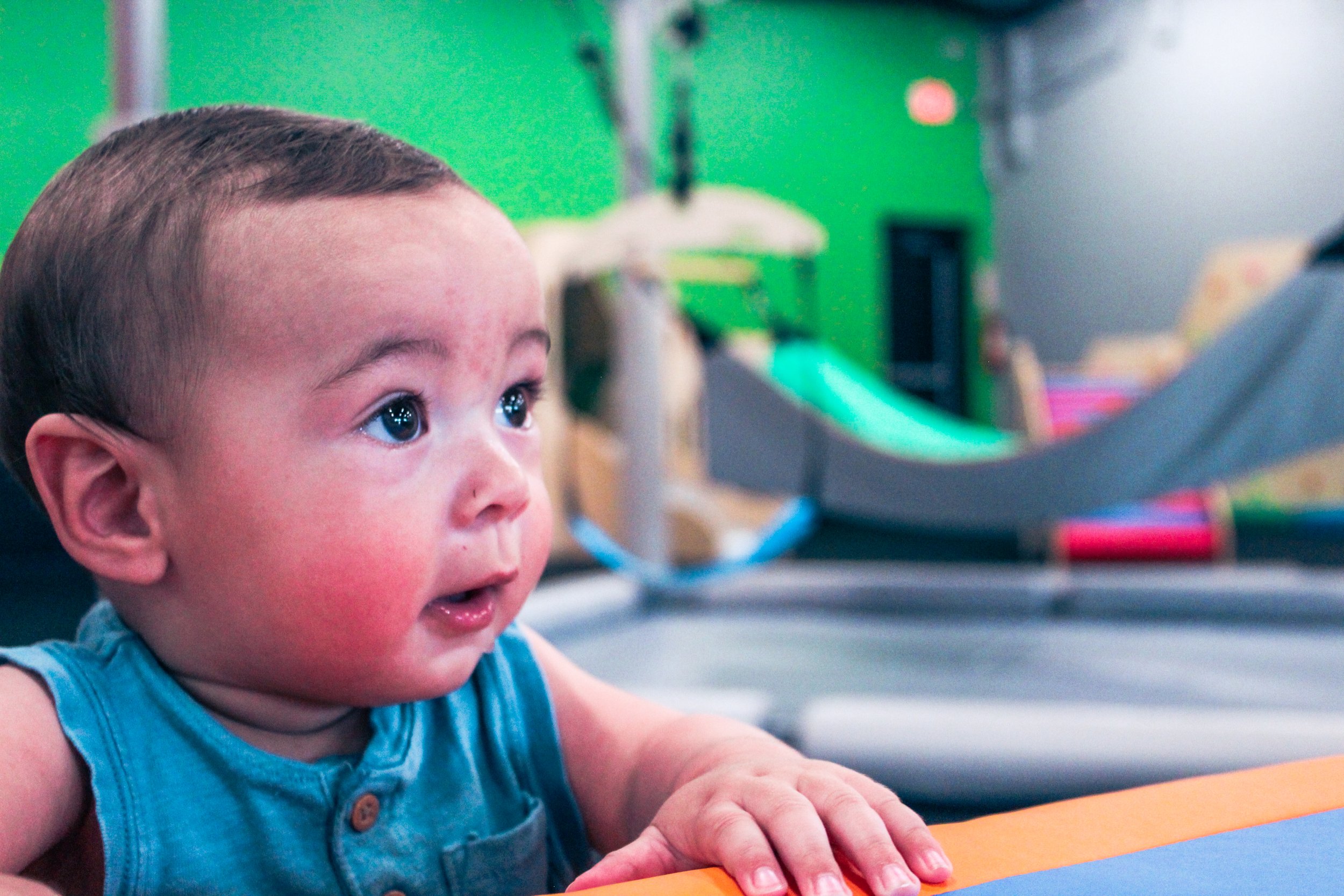 Play and sensory equipment arranged inside Little Land New Braunfels.