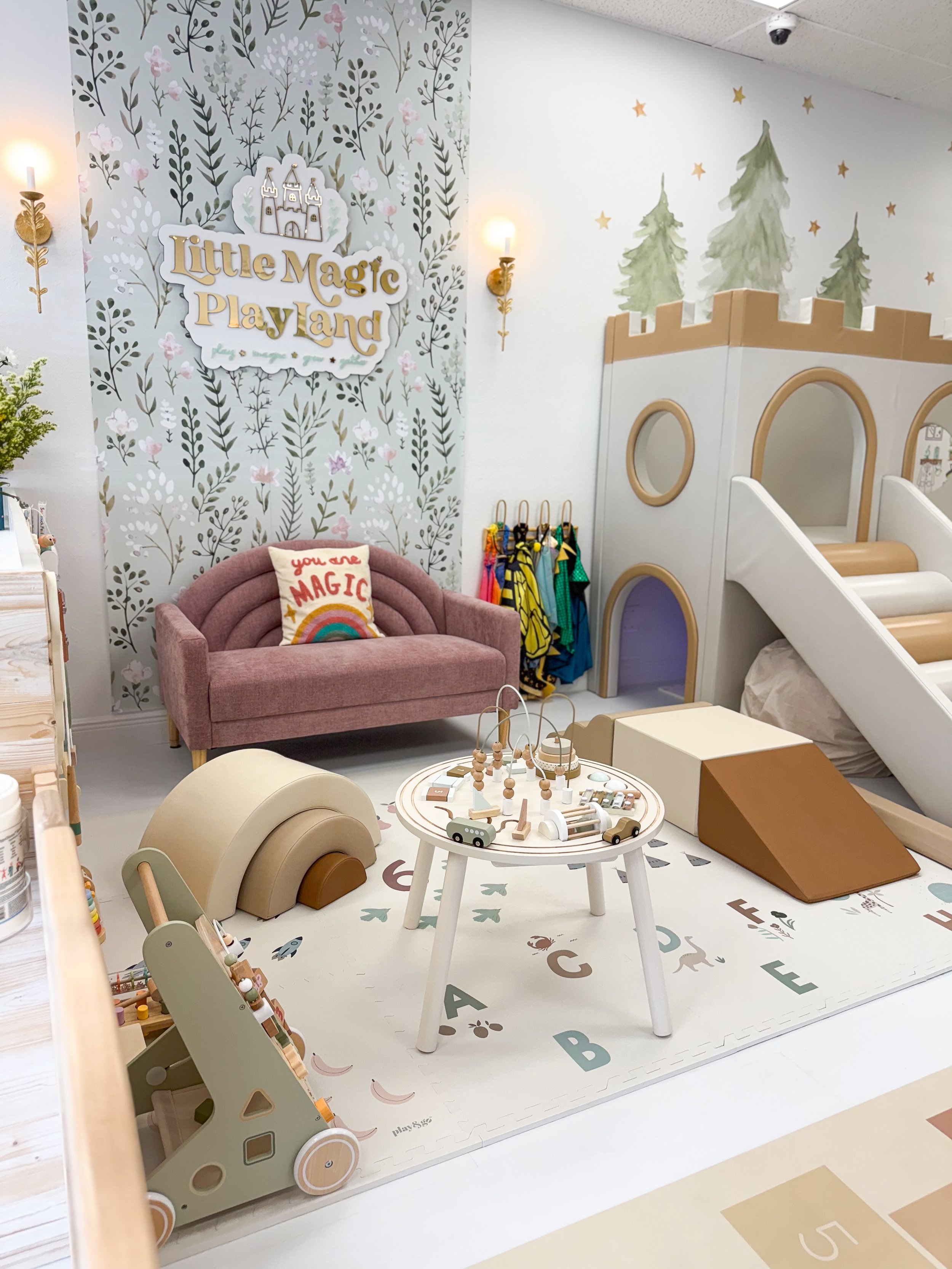 Calm toddler play corner at Little Magic Playland with a small slide and soft play pieces.