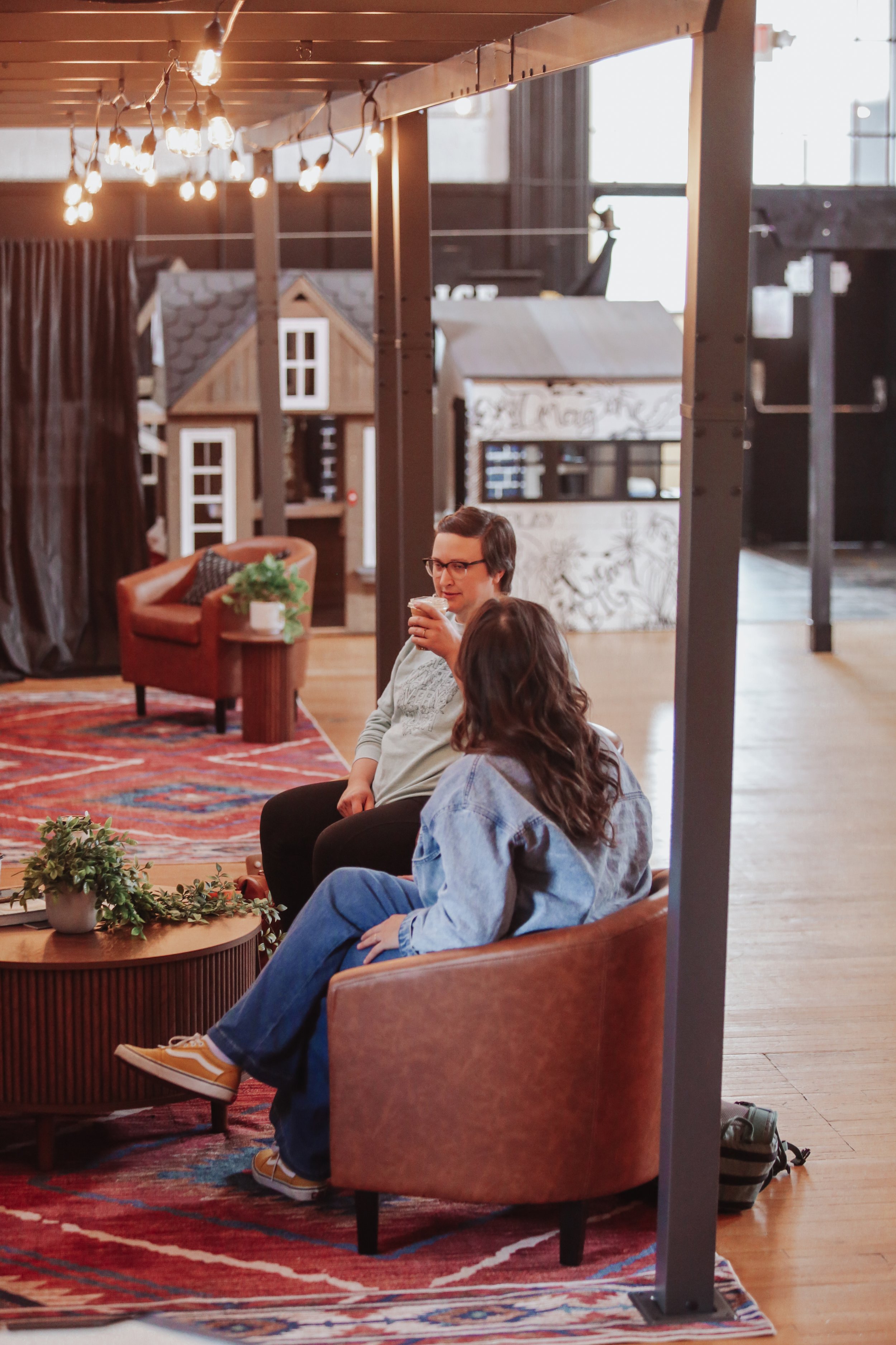 Parent seating and imaginative play zones inside Little Midland