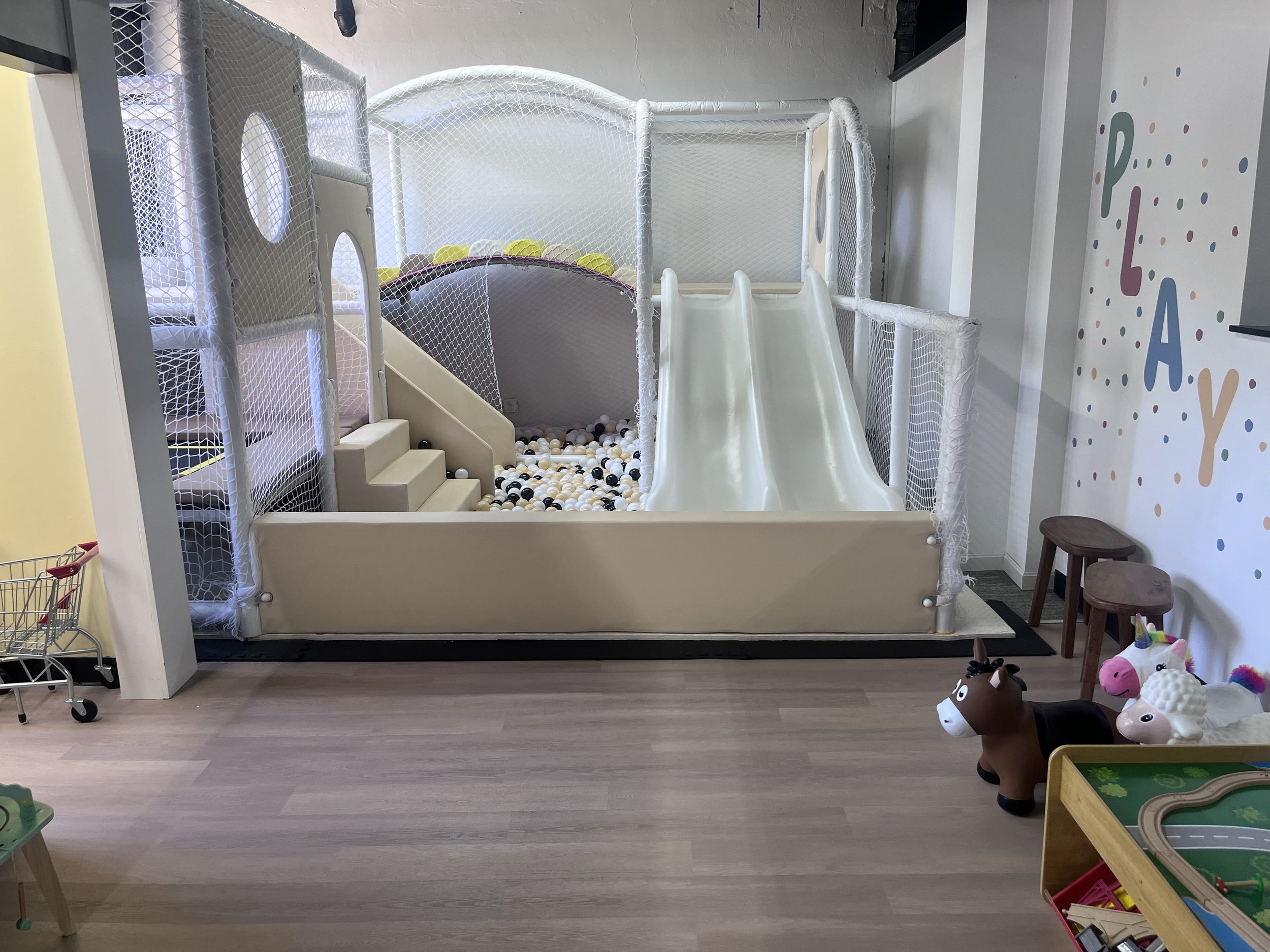 Soft-play climbing and ball-pit structure inside Little Nuggets Softplay Adventures.