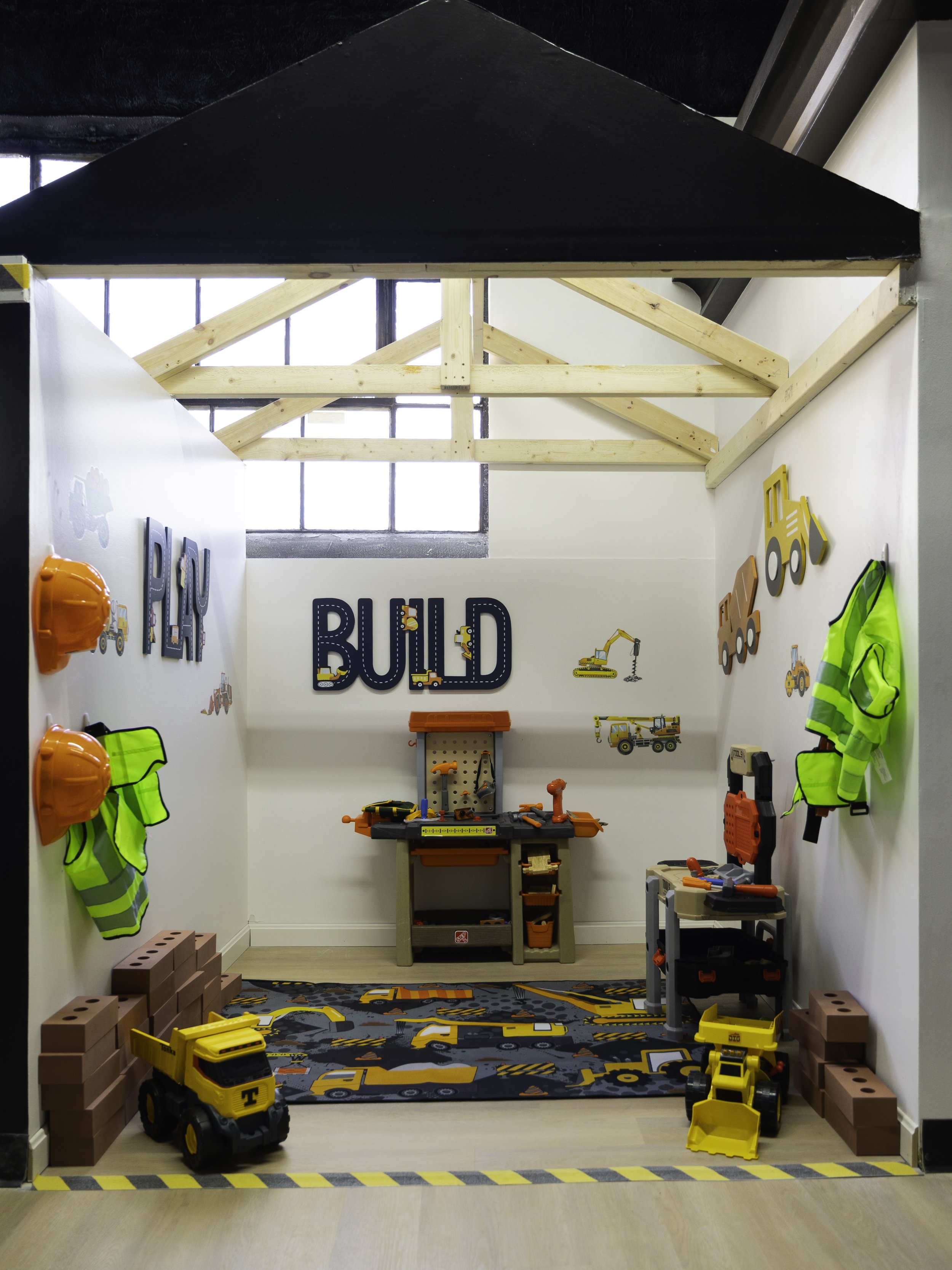 Construction-themed pretend-play room at Little Nuggets.