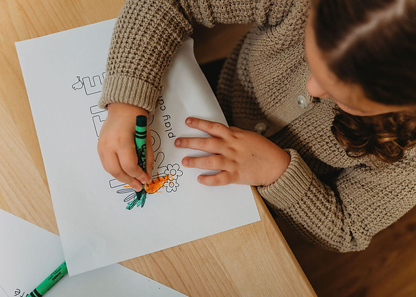 Family-style activity moment at Little Roots Play Cafe.