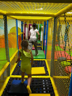 Indoor climbing and crawl structure at Little Sharks Playground.