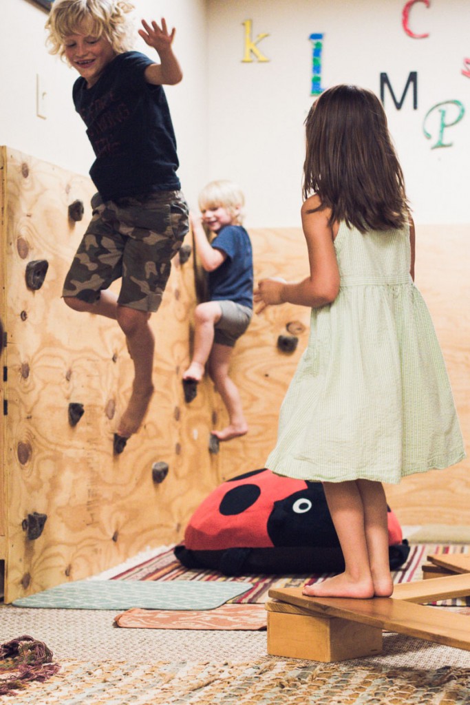 Child climbing inside the Lulu's Casita play space
