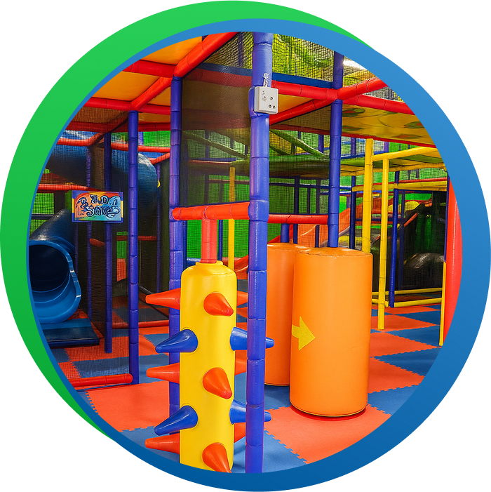 Colorful multilevel play structure inside Luv 2 Play Stockton.