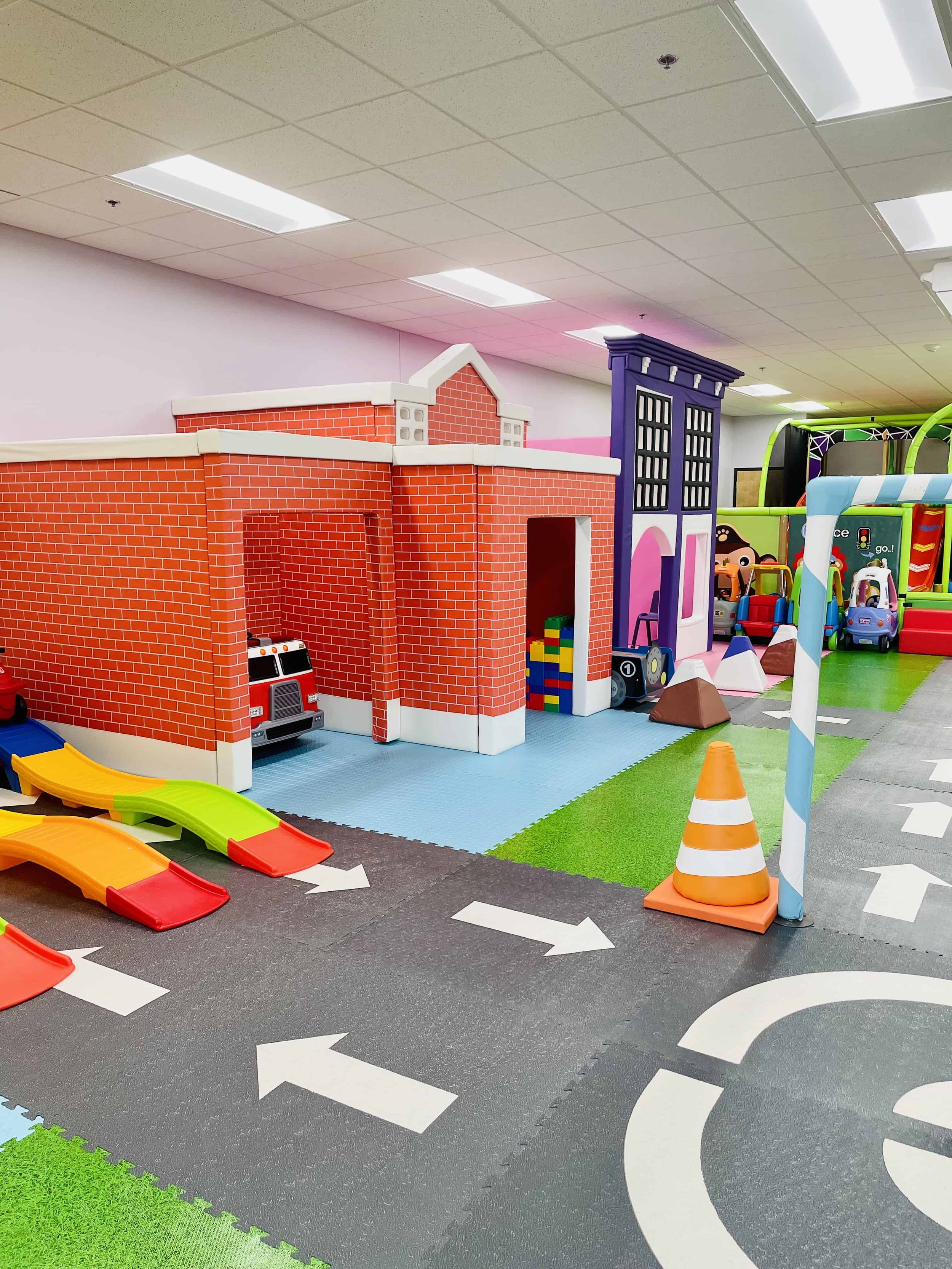 Pretend-play building facades and road at Magic Land
