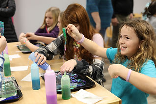 Children playing inside a museum exhibit at Maine Discovery Museum.
