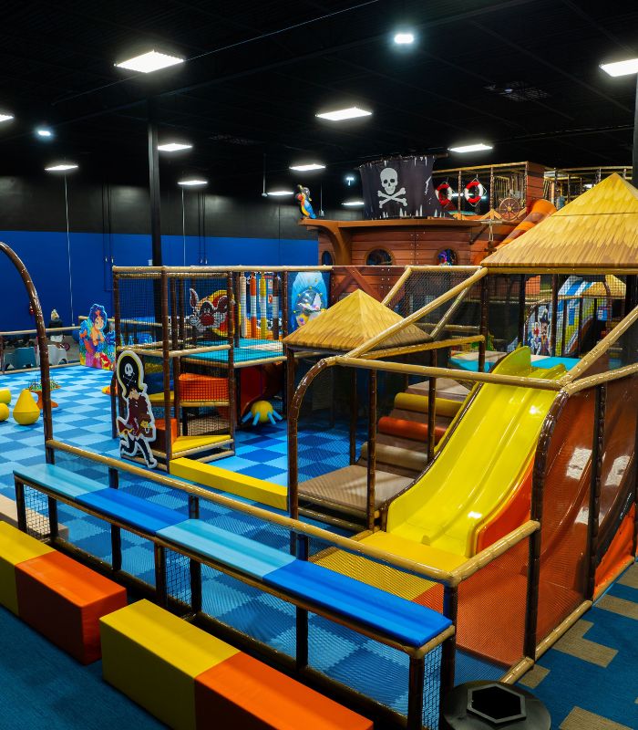 Indoor Bounce Beach play area with slides and climbing features.